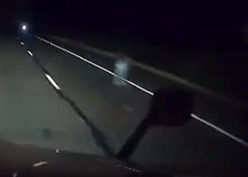 A Truck driver's dashcam catches a ghost on Highway 87, sparking a frenzy in paranormal interest; cover
